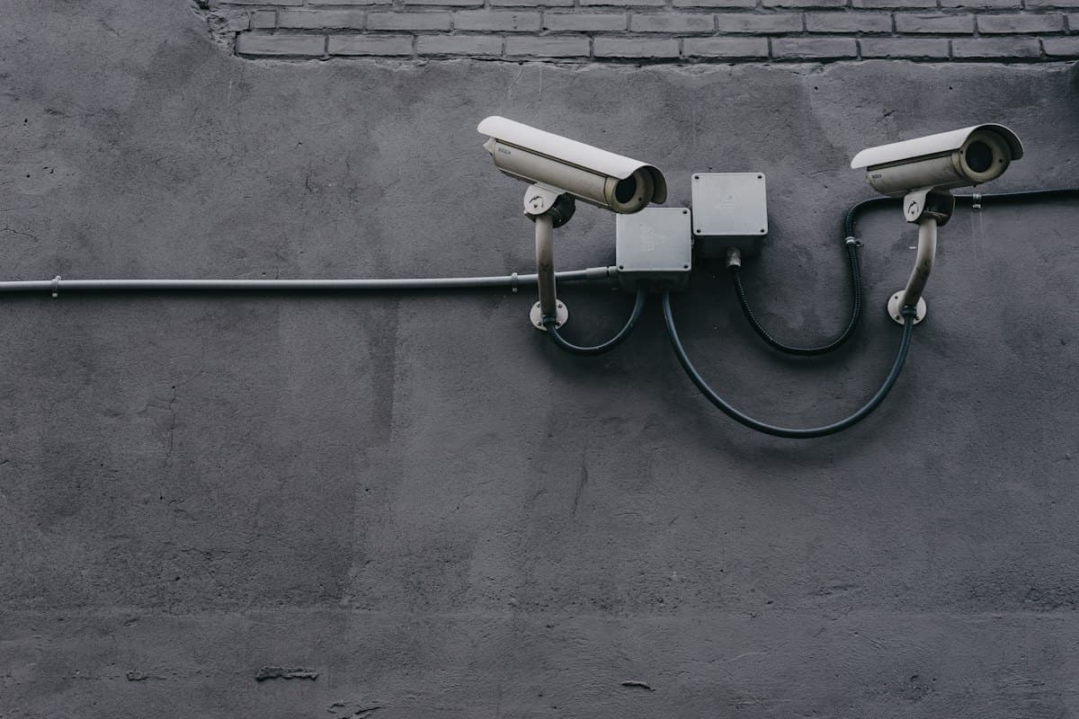 Two CCTV cameras mounted on a wall