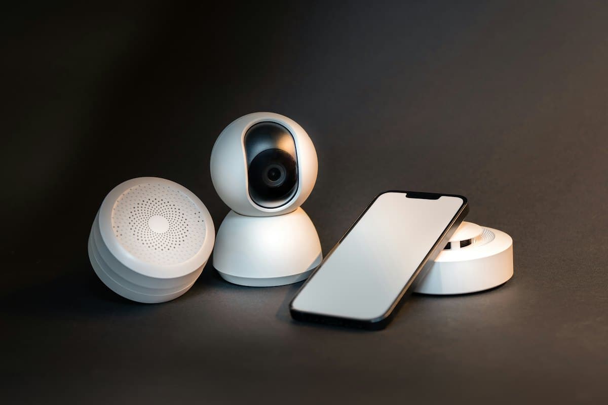 A smart camera and sensors beside a phone