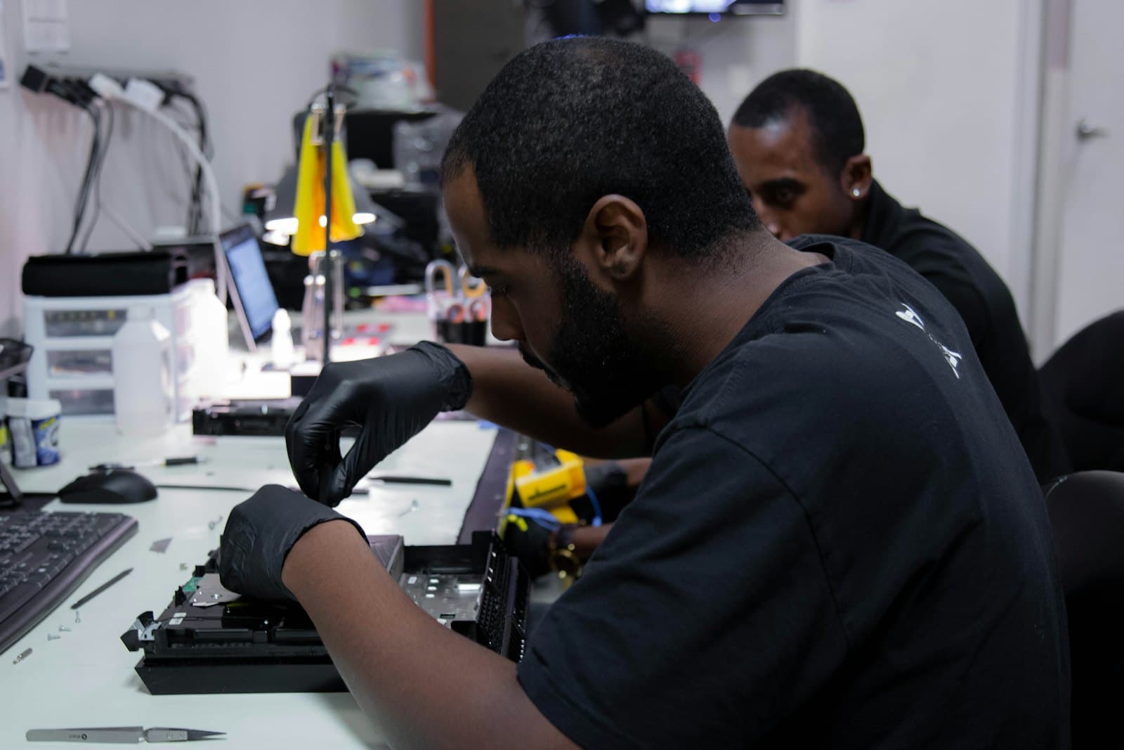 Technician setting up computer hardware