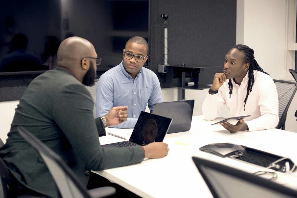 Colleagues planning a system around a table