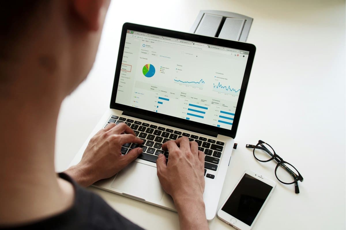 A marketer reviewing analytics on a laptop